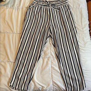 White and navy blue striped trousers.